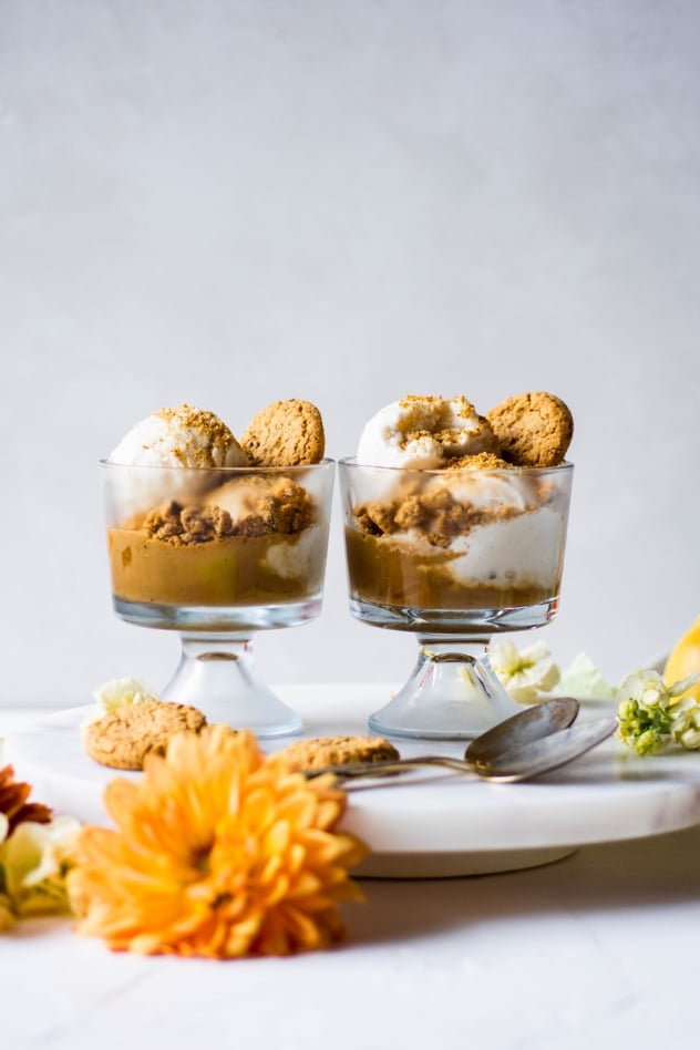These cardamom caramel and pear cookie crumble cups are made with fragrant pears simmered in a cardamom and cinnamon spiced coconut sugar caramel. Served with your favorite dairy free vanilla ice cream and Simple Mills crunchy toasted pecan cookies. A crazy delicious seasonal dessert that is naturally sweetened, vegan and paleo friendly!