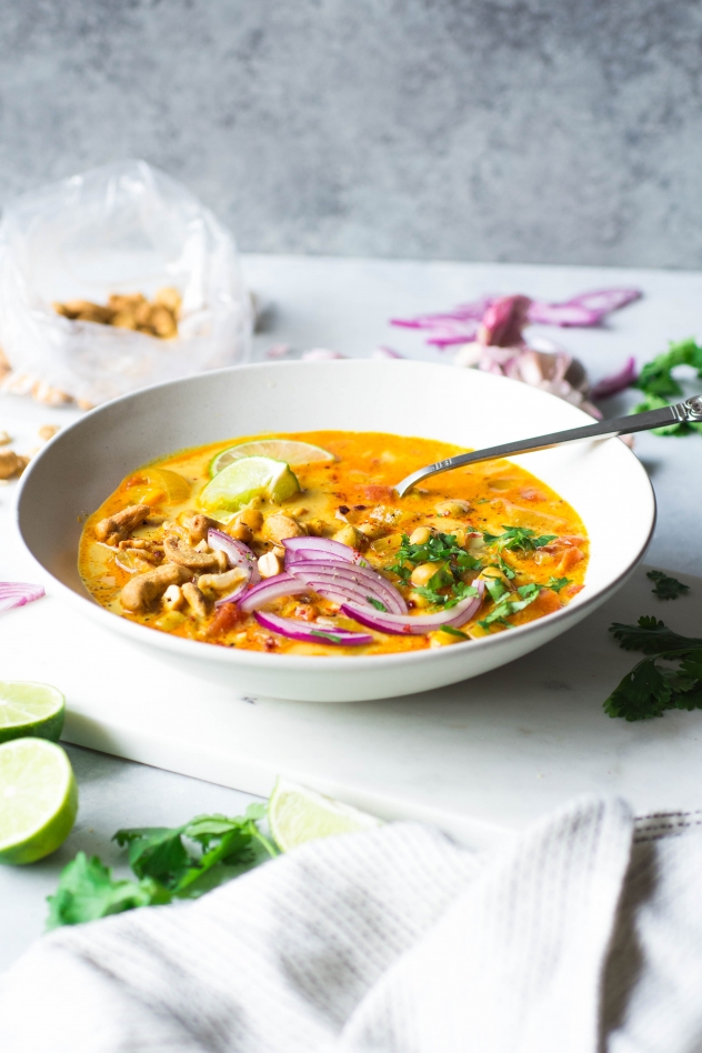 This 30 minute chickpea and tomato coconut curry soup is made in 30 minutes with mostly with pantry staples, and has a TON of flavor. It's the perfect meatless weeknight comfort soup! Vegan and gluten free.