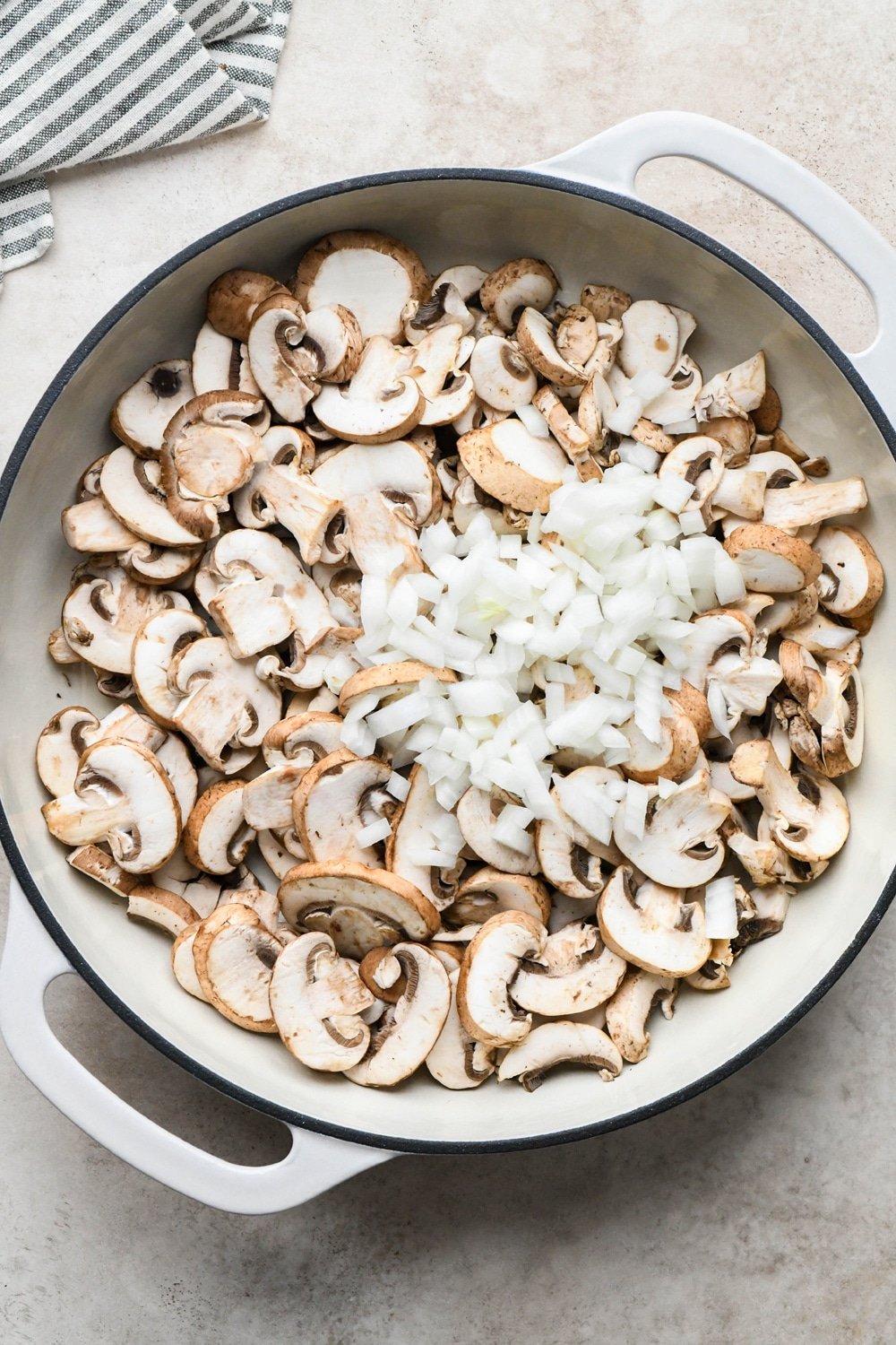How to make Gluten Free Mushroom Gravy: Mushrooms and onions in a large skillet before sautéing. 