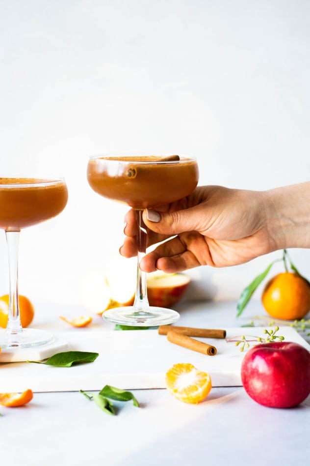 This spiced apple and tangerine spritz is the perfect fancy make-at-home drink for fall! Made with spiced rum (or vodka!), fresh apple cider, bright tangerine juice, and finished with sparkling hard apple cider for a festive and delicious beverage worthy of a toast!