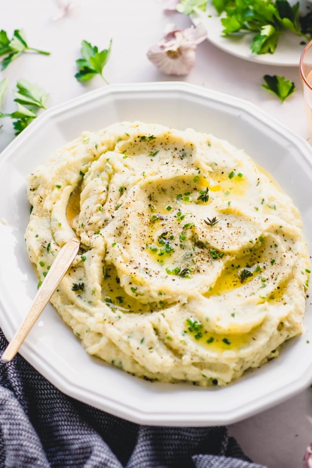 This whipped parsnip with fresh herbs recipe is a delicious alternative to mashed potatoes! A crave worthy seasonal side dish that is perfect for the holidays or a cozy comfort food meal at home. Paleo, gluten free and with a vegan option!