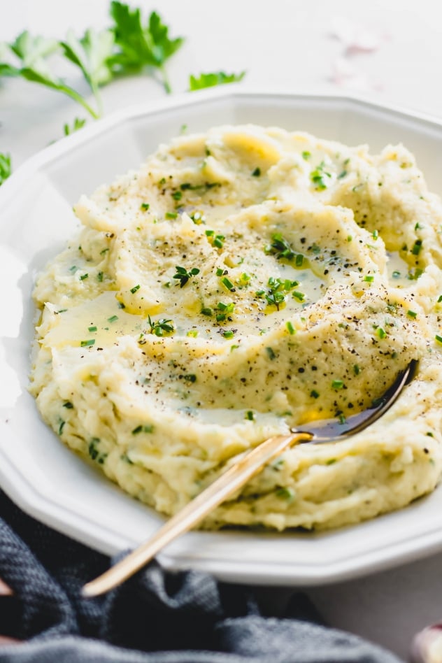 This whipped parsnip with fresh herbs recipe is a delicious alternative to mashed potatoes! A crave worthy seasonal side dish that is perfect for the holidays or a cozy comfort food meal at home. Paleo, gluten free and with a vegan option!