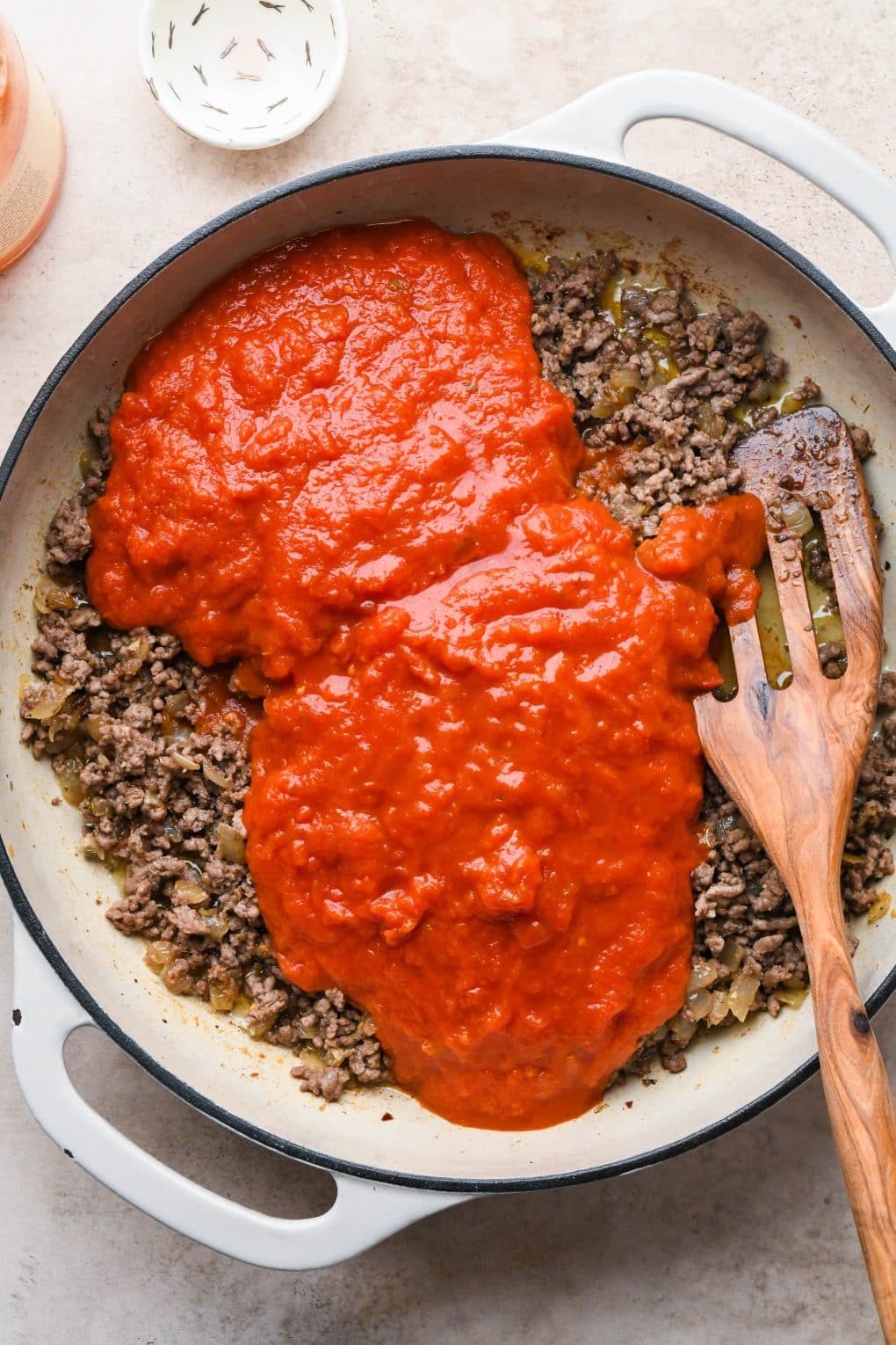 How to make Easy Marinara Sauce with Ground Beef: Jarred marinara sauce added to skillet with aromatics and cooked meat.