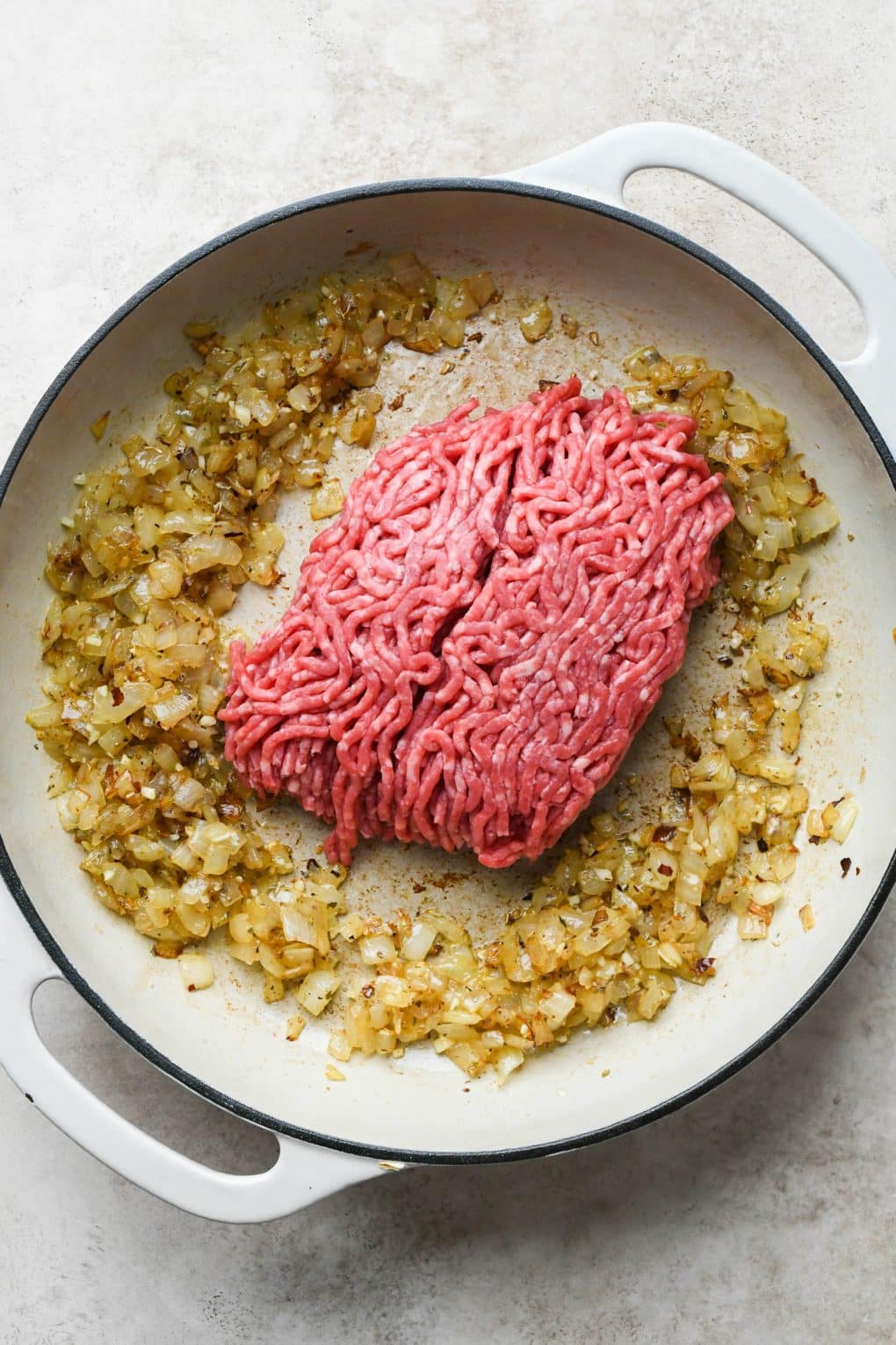 How to make Easy Marinara Sauce with Ground Beef: Ground beef added to skillet with onions and spices.