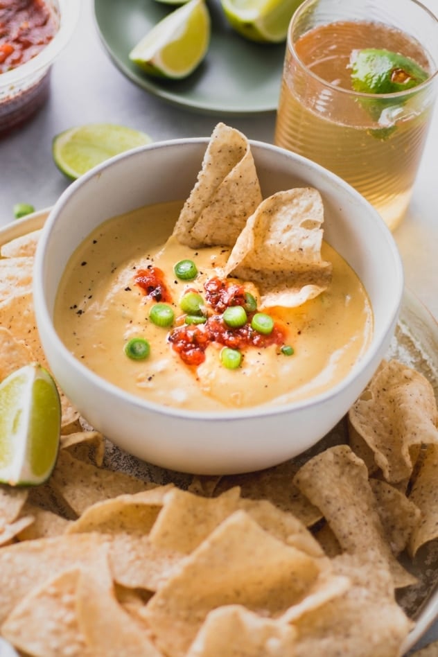This creamy cashew queso dip is made with ZERO processed ingredients, for an authentic tasting, full flavored, dairy free alternative to this well loved dip. SO crave worthy and made with anti-inflammatory, good-for-you ingredients! Vegan + whole30 compliant.
