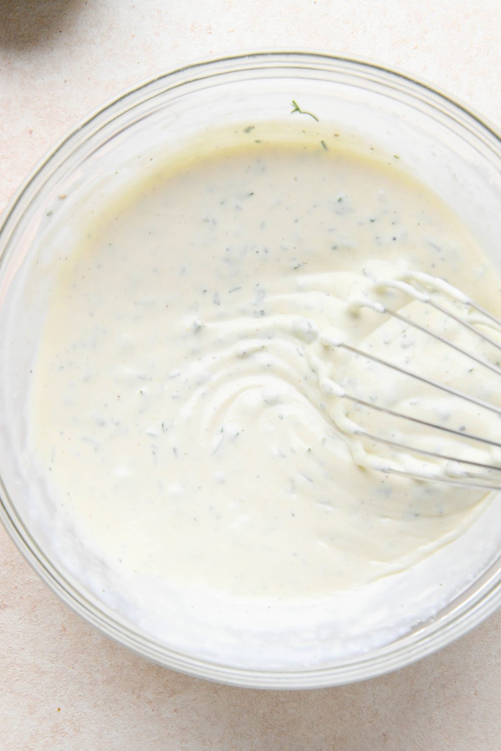 How to make dairy free ranch dressing: whisking all ingredients together with water.