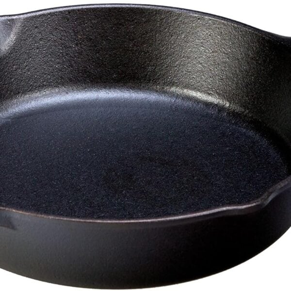 A black cast iron skillet with a handle and a small side grip, shown on a white background. The surface appears smooth and seasoned, ready for cooking.