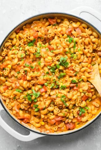 How to make Vegan Mexican Taco Pasta: Finished pasta in skillet topped with a scatter of fresh cilantro on top.