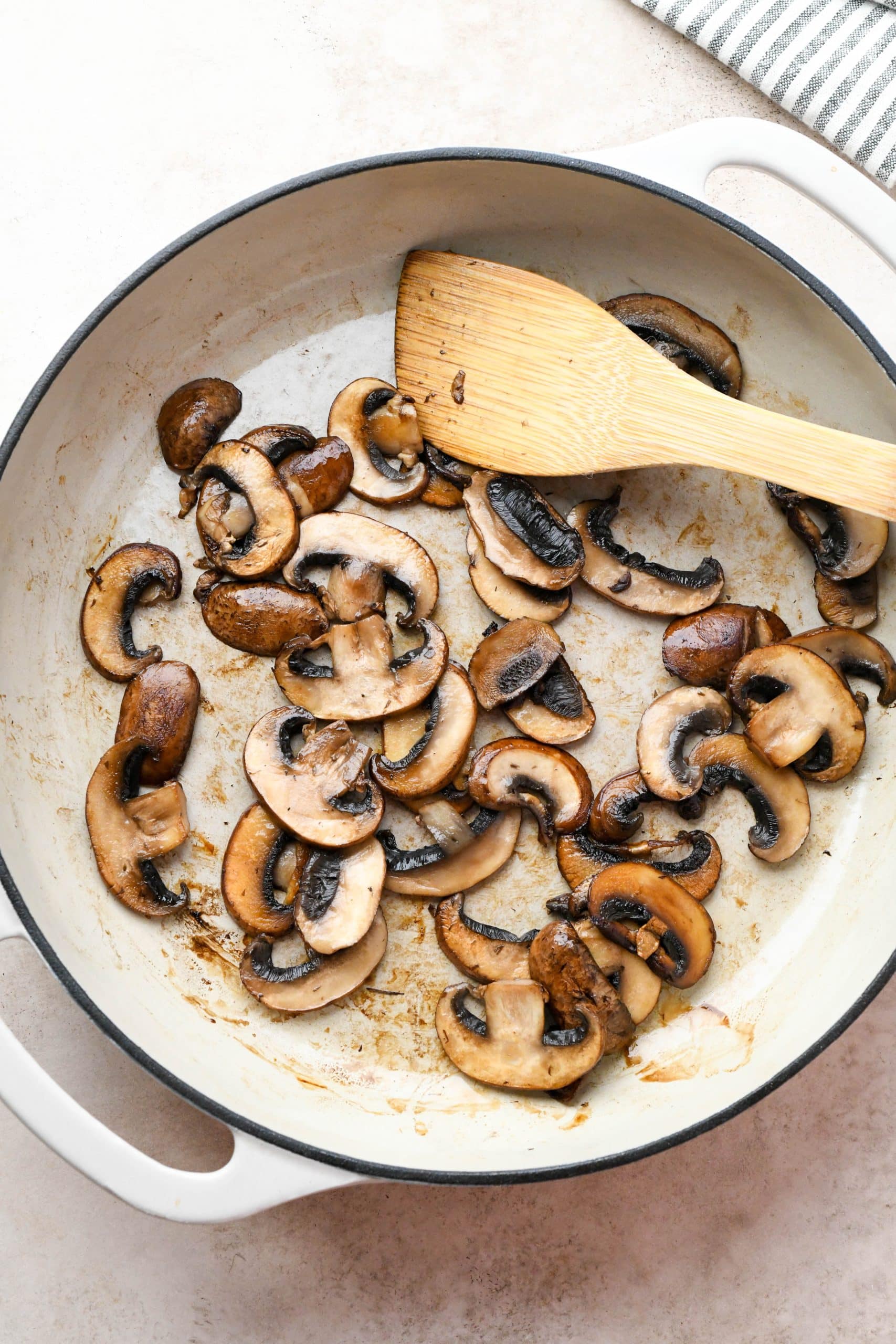 How to make soba noodle stir fry: Seared mushrooms in a skillet.