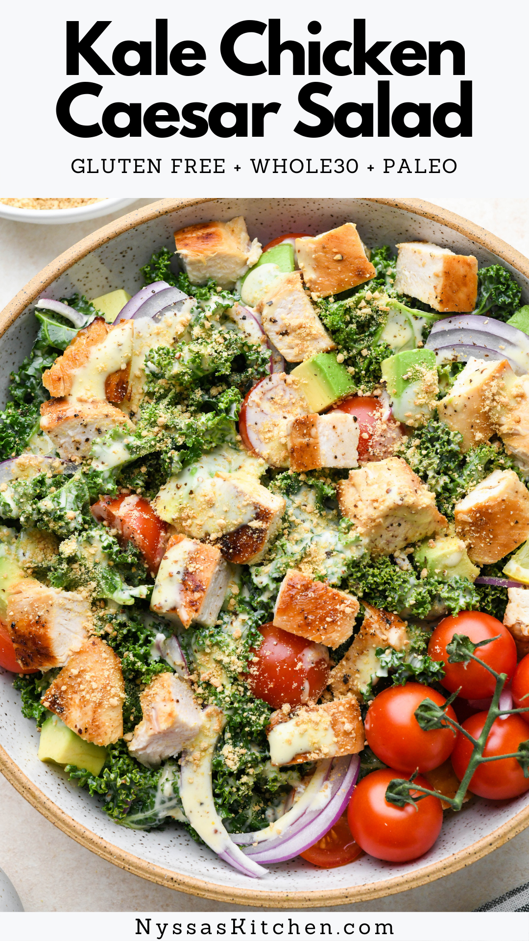 This Whole30 kale chicken Caesar salad is SUCH a crave worthy Whole30 meal! Made with hearty kale, perfectly seasoned chicken, a delightfully creamy homemade Whole30 caesar dressing, tomatoes, avocado, and red onion, and topped with a dairy free parmesan "cheese". Just like your favorite Caesar salad, but healthier! Whole30, paleo, gluten free, dairy Free.