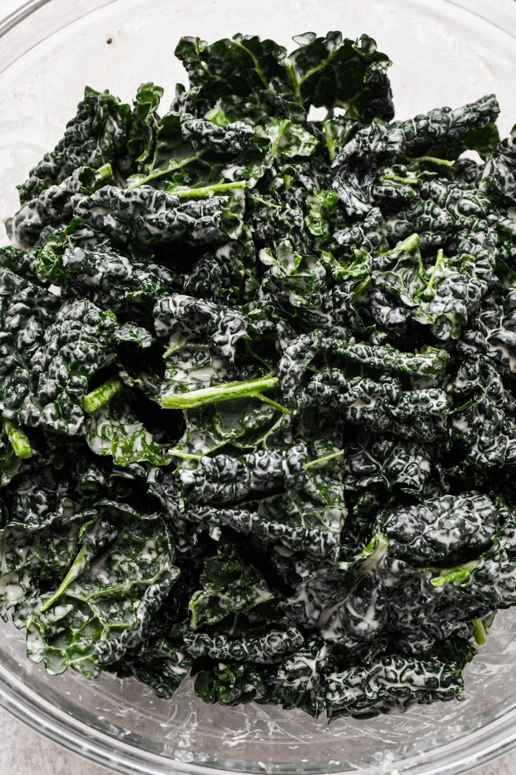 Raw kale leaves massaged with creamy tahini dressing. 