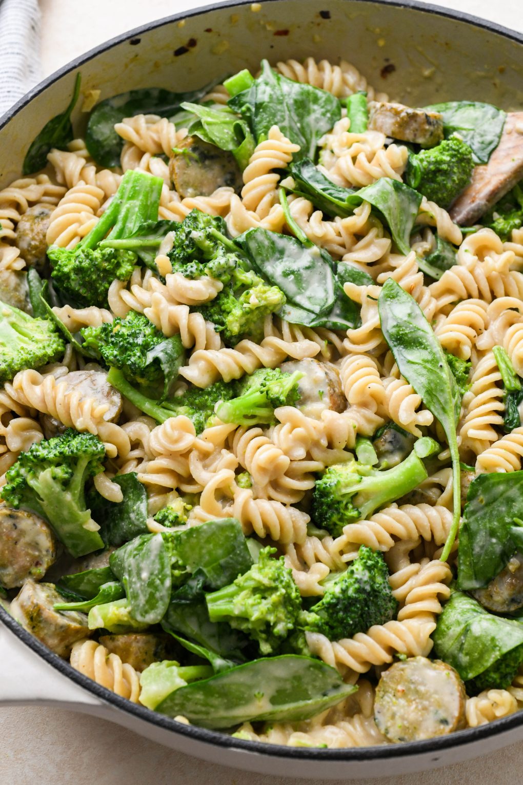 How to make healthy chicken sausage pasta: Pasta tossed together.