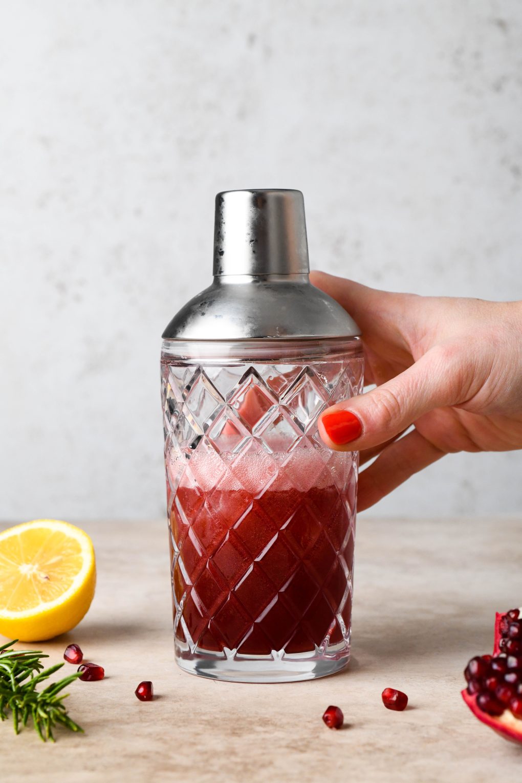 How to make Festive Pomegranate Champagne Cocktail: Cocktail shaken in cocktail shaker.