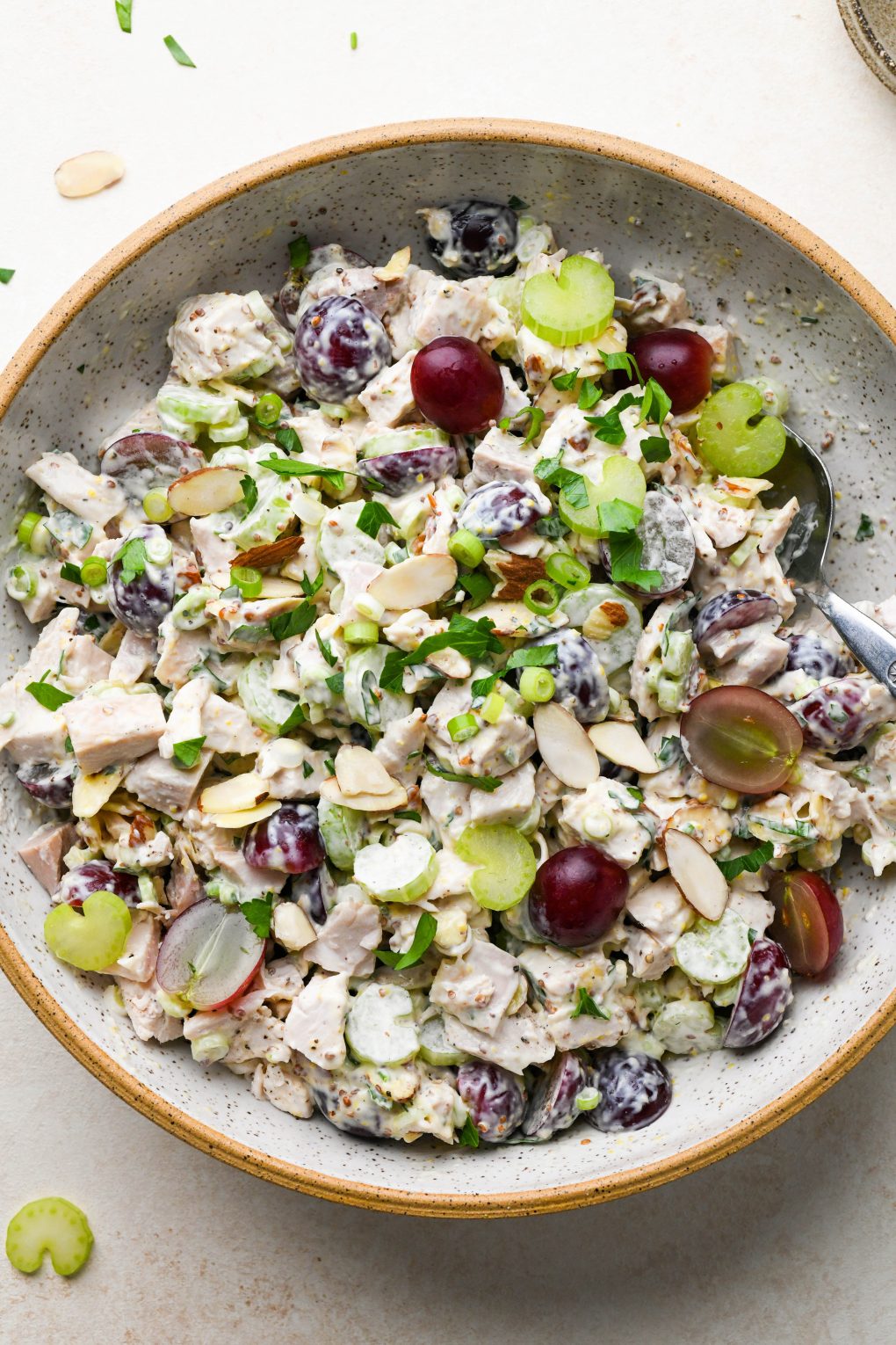 Chicken salad with grapes in a large ceramic speckled bowl