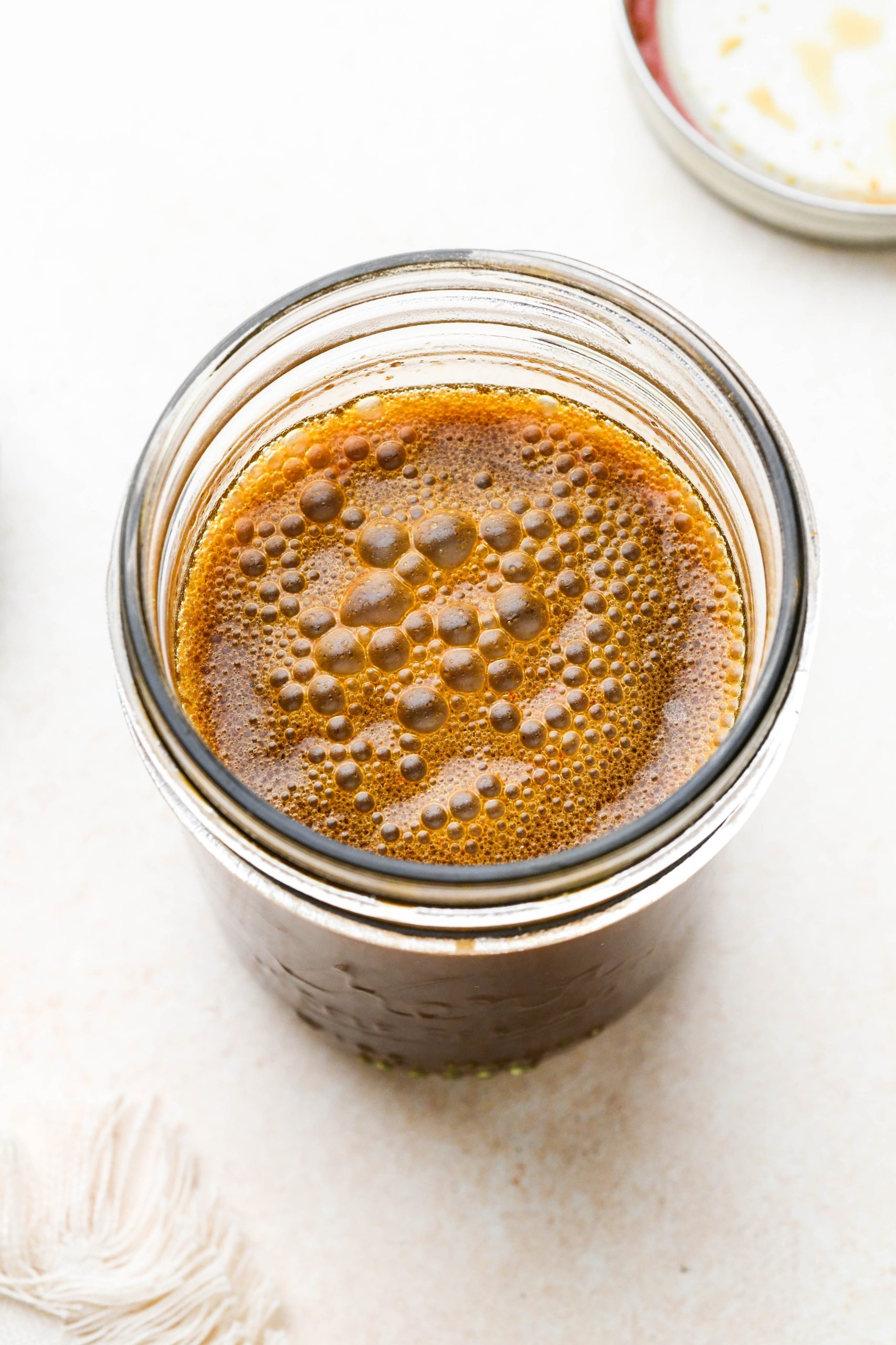 How to make homemade stir fry sauce: Sauce shaken together in a small mason jar.