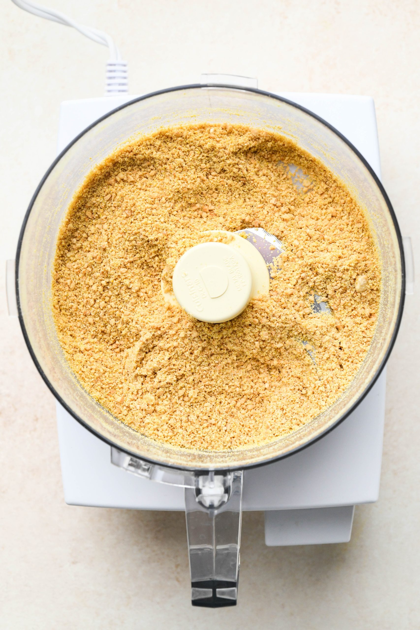 How to make Vegan Parmesan Cheese: Parmesan cheese in the food processor after pulsing together.