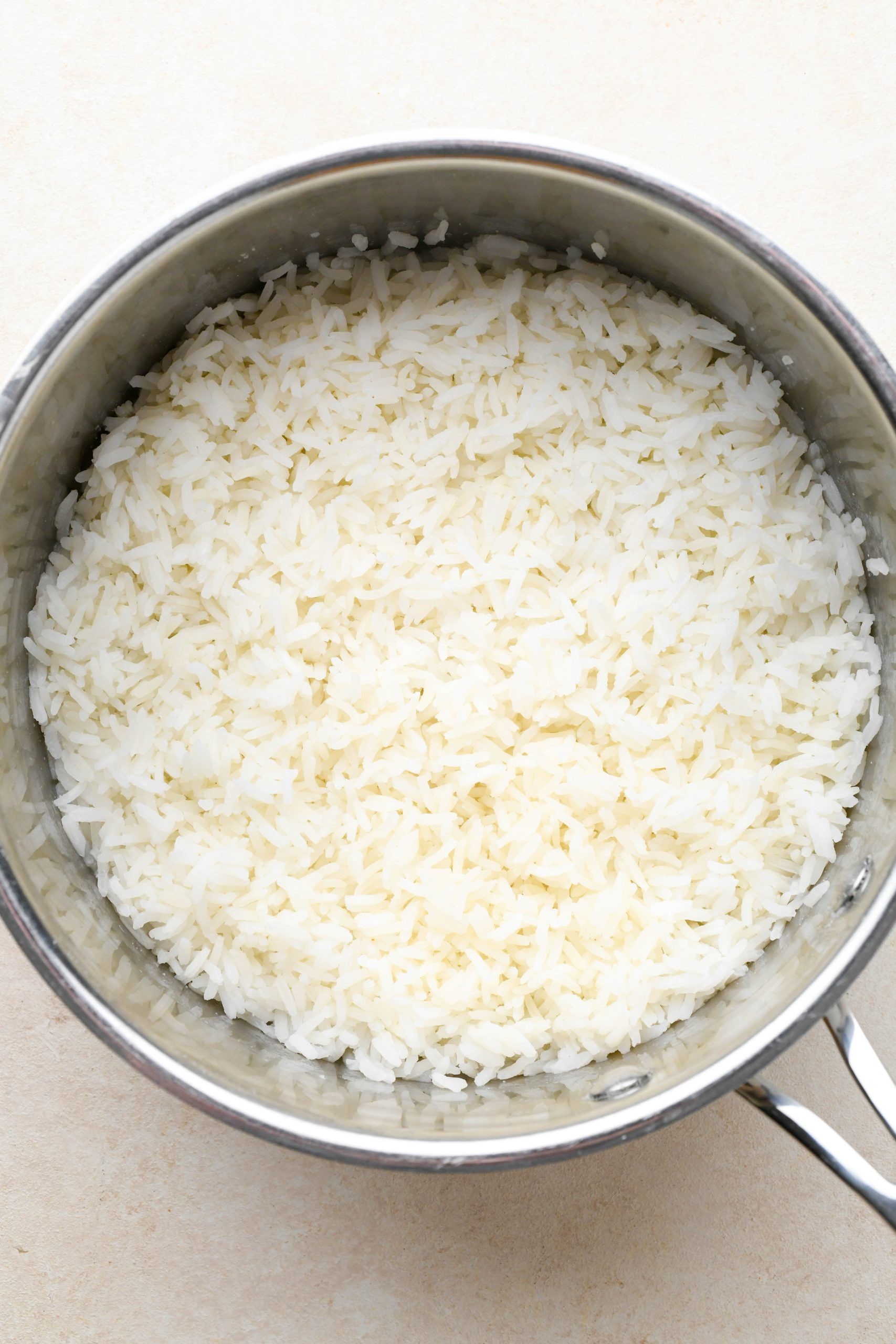 How to make cilantro lime rice: Rice cooked in a large sauce pan.