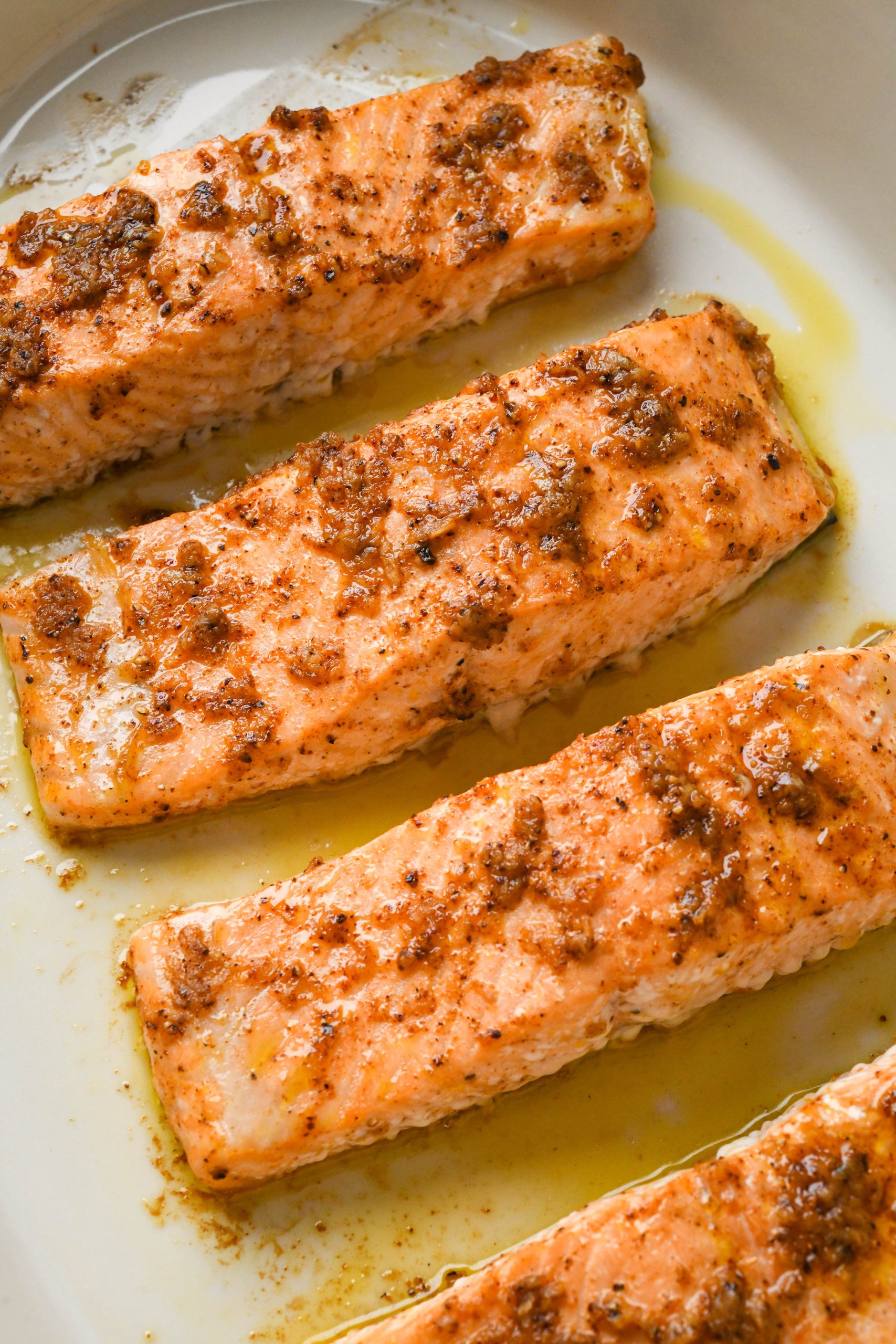 How to make baked salmon: Coated salmon fillets after baking in a baking dish.