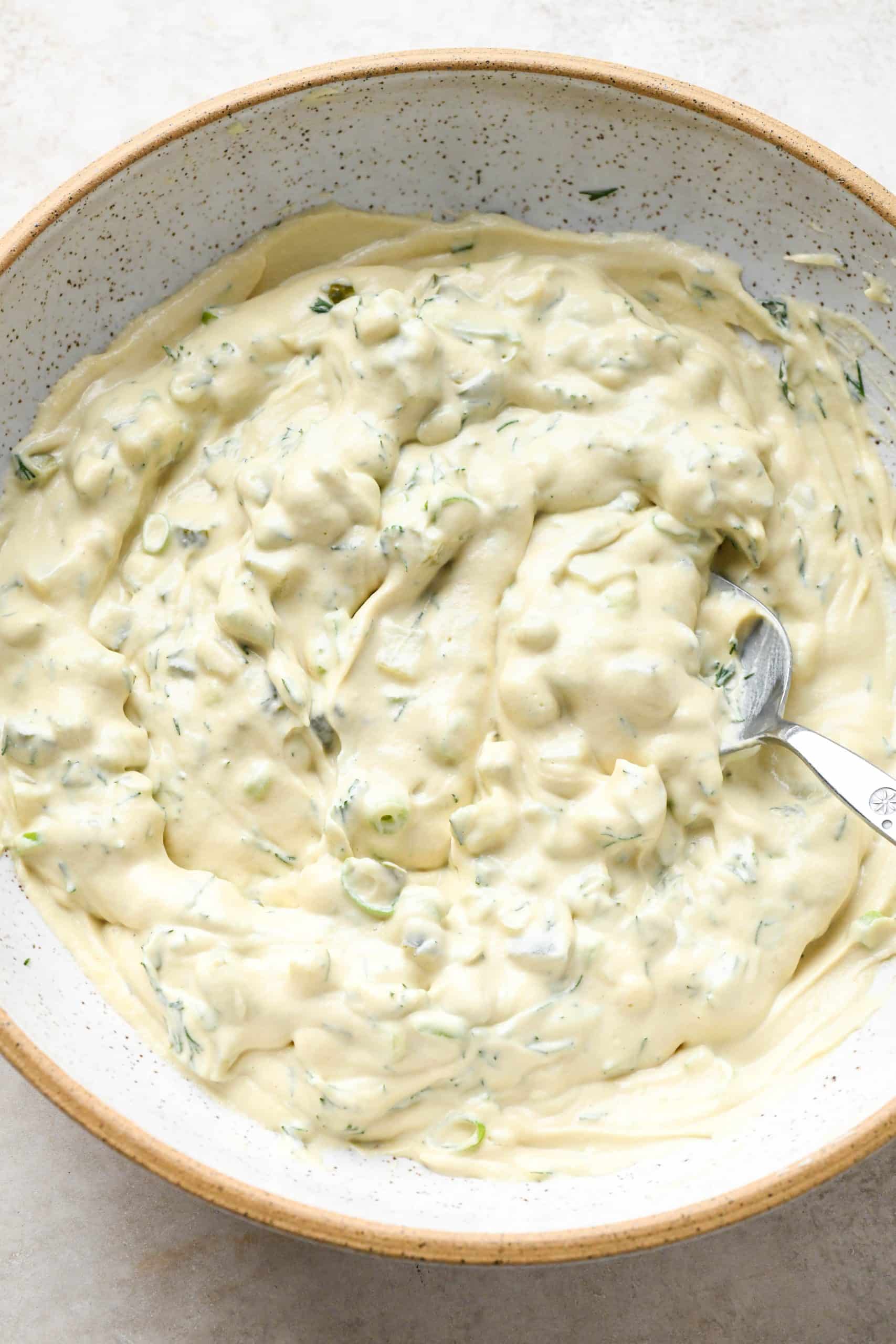 How to make Dairy Free Dill Pickle Dip: Pickle dip all mixed together in a large bowl.