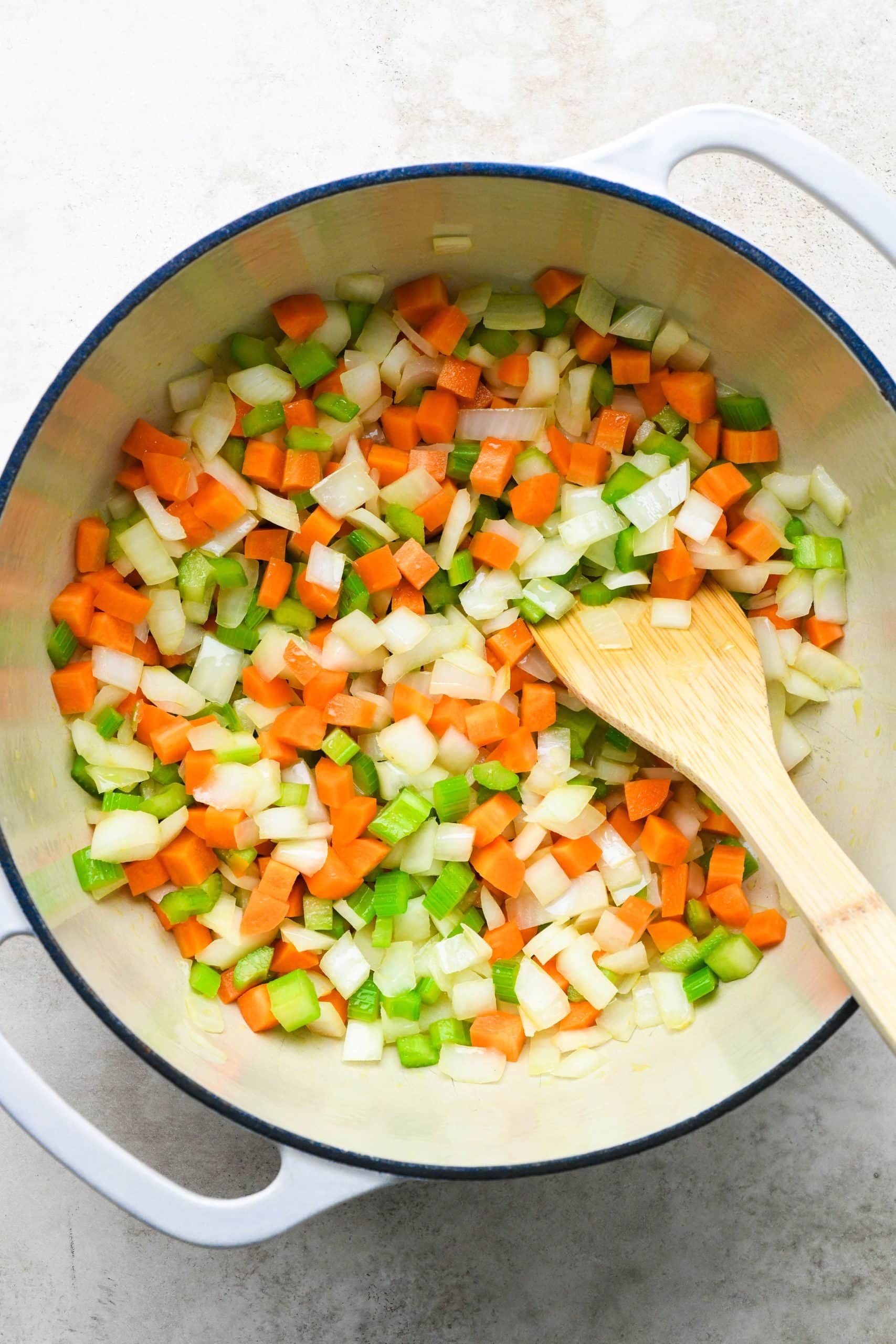 How to make shepherds pie soup: Sautéing onions, celery, and carrots in a large soup pot with olive oil. 