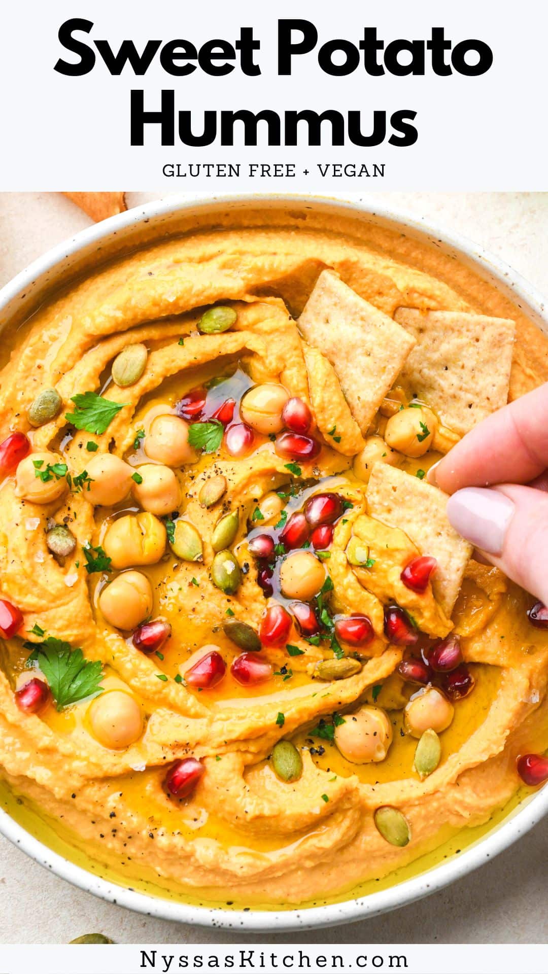 Sweet potato hummus is an extra yummy seasonal twist on a classic hummus recipe that makes the best healthy snack or appetizer for your next get together (or weekly meal prep)! Made with chickpeas, roasted sweet potatoes, a blend of flavorful spices, tahini, and lemon juice. A perfect snack for dipping your favorite crackers and veggies. Gluten free, vegan, dairy free.