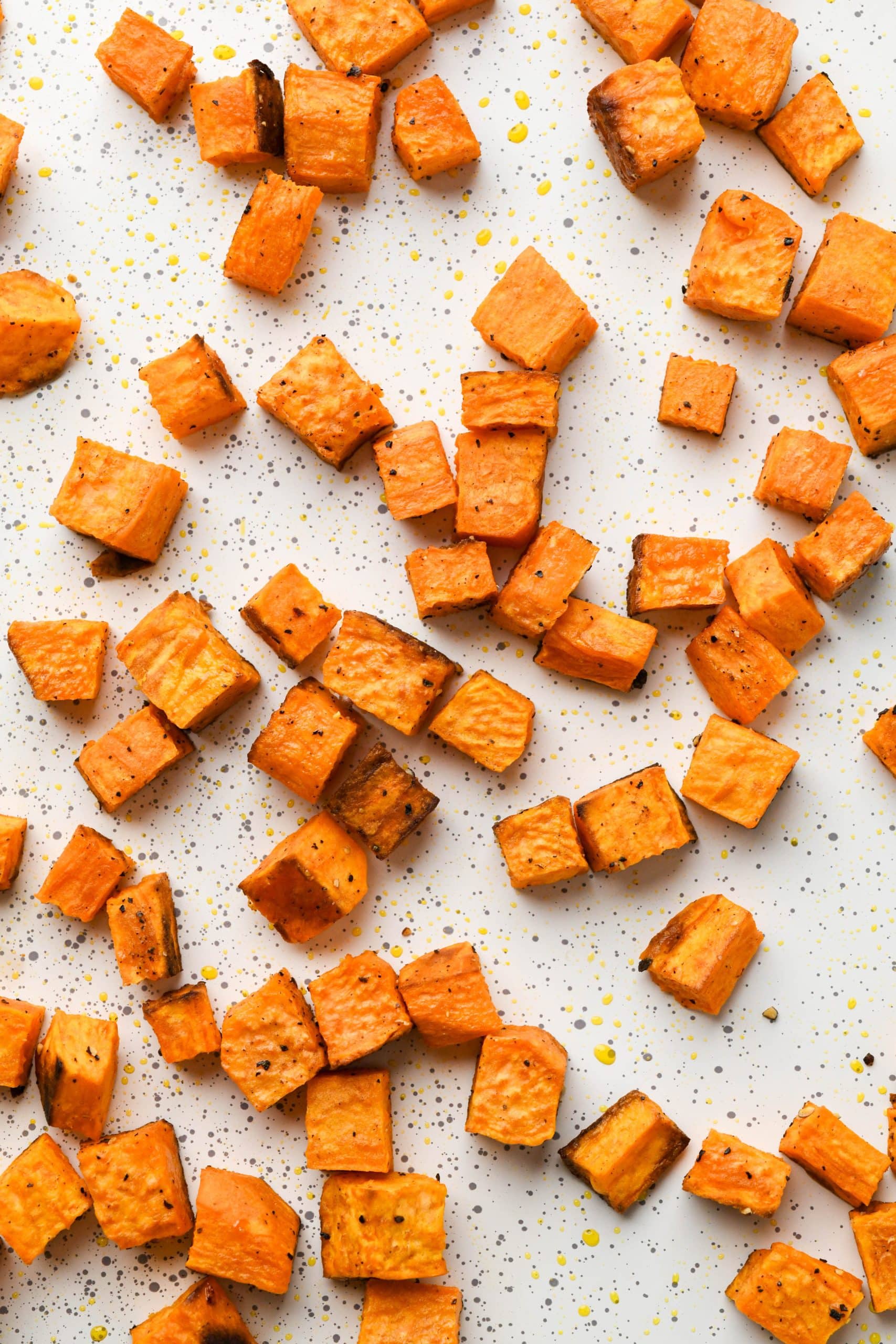 How to make Sweet Potato Hummus: Roasted sweet potato cubes on baking sheet.