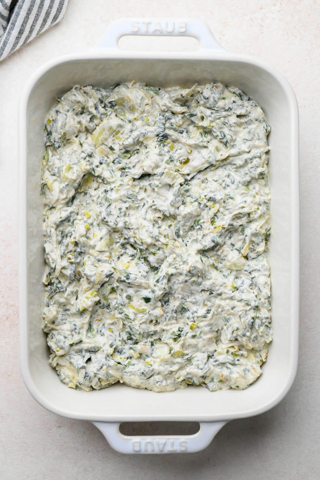 How to make Dairy Free Spinach Artichoke Dip: Dip in small baking dish before baking.