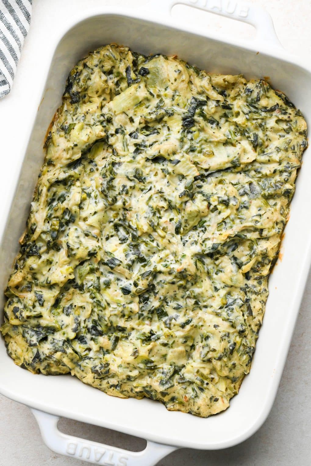 How to make Dairy Free Spinach Artichoke Dip: Dip after baking - slightly darker in color and light brown on the edges.