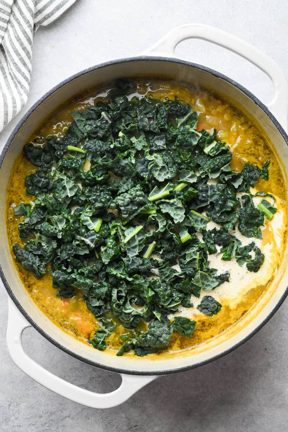 How to make White Bean and Kale Soup: Raw kale added to the soup.
