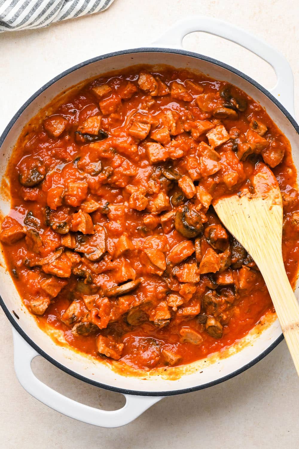 How to make Creamy Tomato Sausage Pasta: Marinara sauce added to skillet after stirring. 