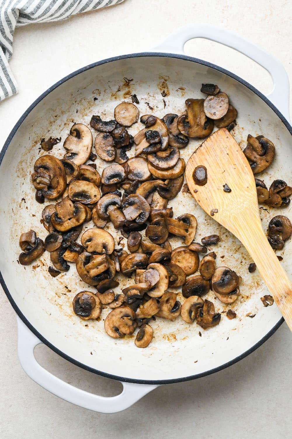 How to make Creamy Tomato Sausage Pasta: Cooked mushrooms in skillet.