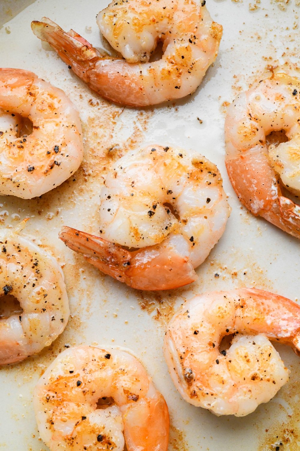 How to make Pan Seared Shrimp: Fully cooked seasoned shrimp in a enameled cast iron skillet.