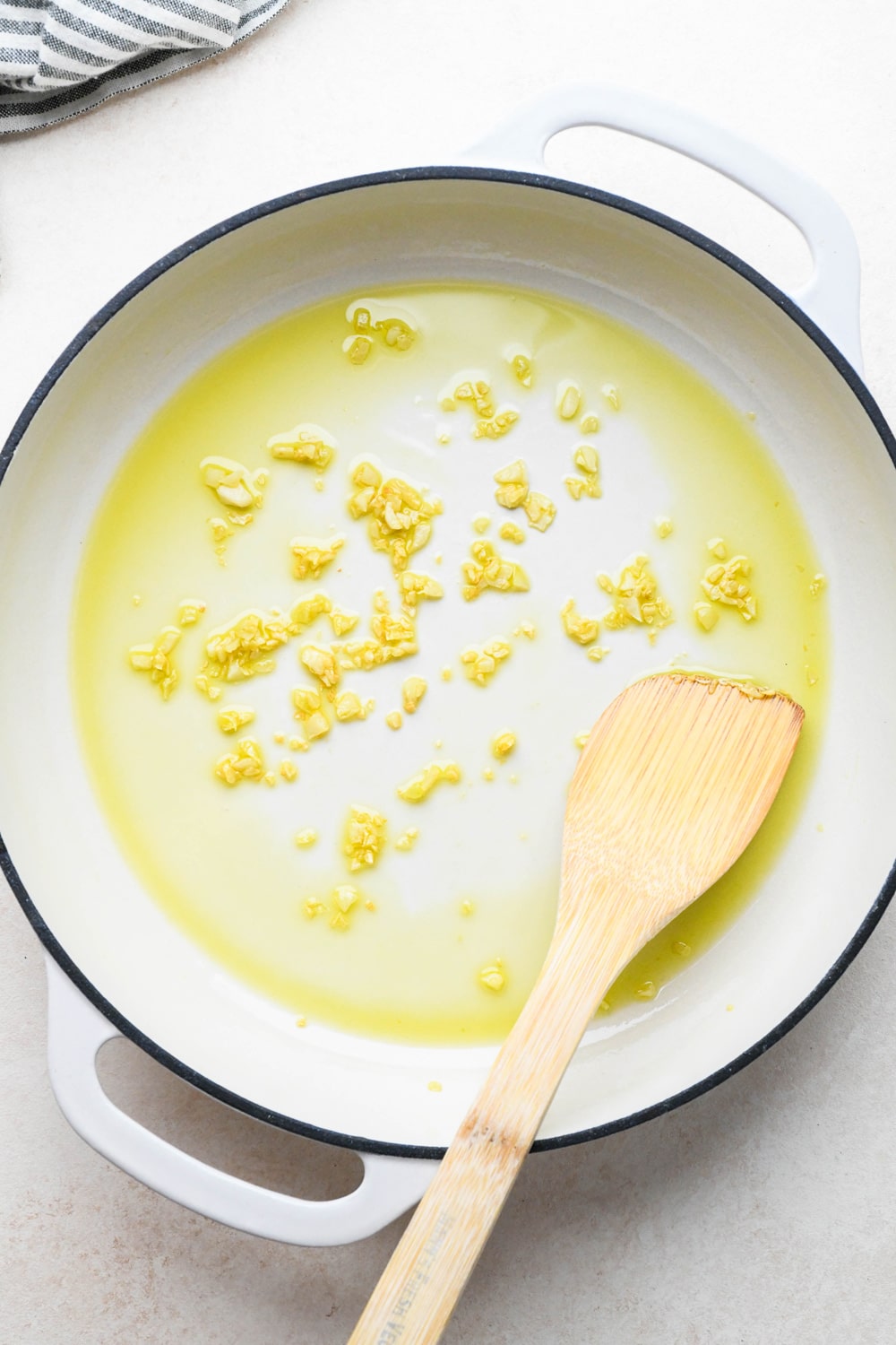How to make Creamy Dairy Free Corn Pasta with Basil: Olive oil and garlic in skillet after sautéing. 