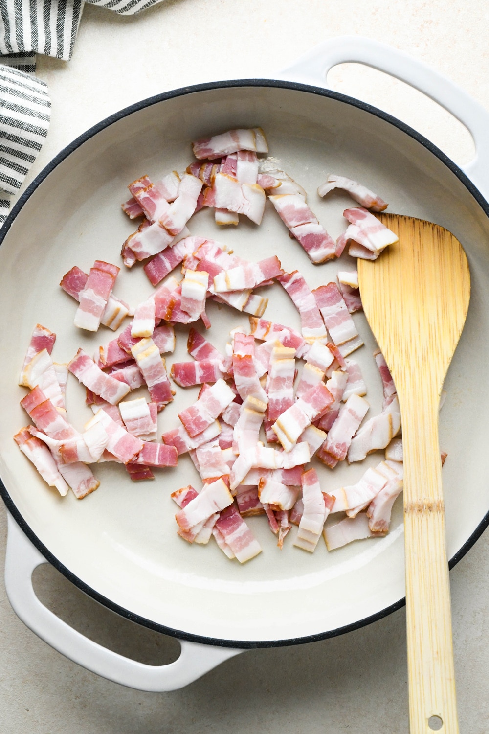How to make Dairy Free Butternut Squash Pasta: Diced bacon in a skillet before cooking.