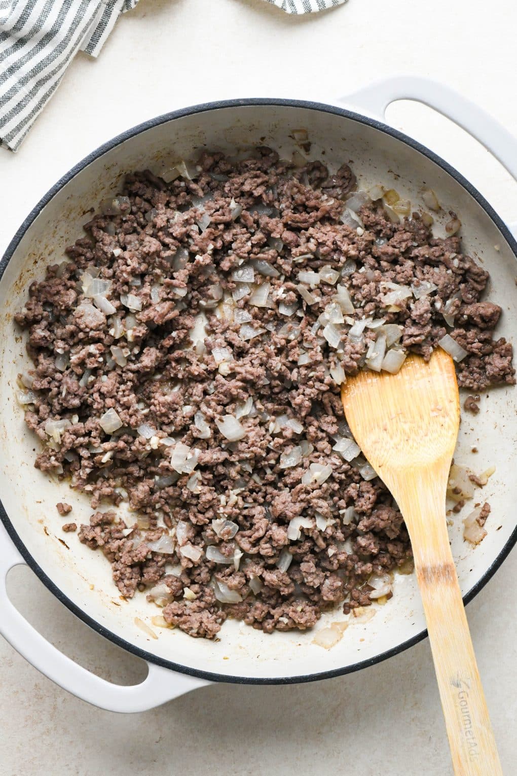 How to make Dairy Free Beef Stroganoff: Ground beef, onions, and garlic in the same skillet that the mushrooms were cooked in after removing them, beef browned and broken up.