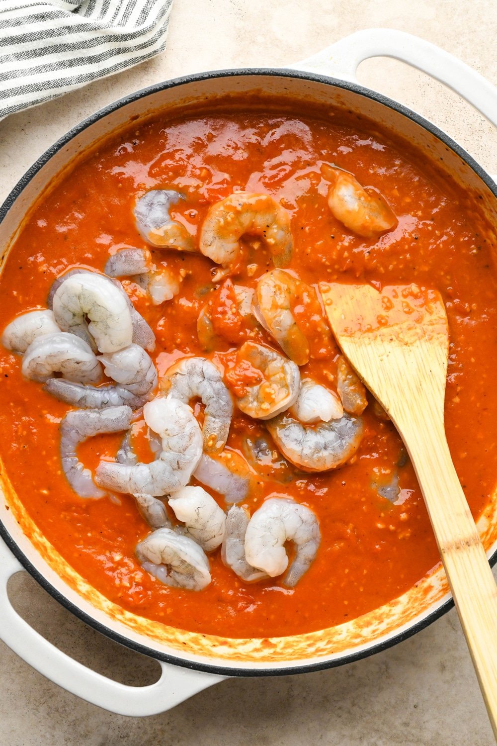 How to make Burst Cherry Tomato Shrimp Pasta: Raw shrimp added to the burst cherry tomato sauce.