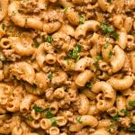 A close up of the noodles in creamy dairy free hamburger helper topped with fresh parsley and black pepper.