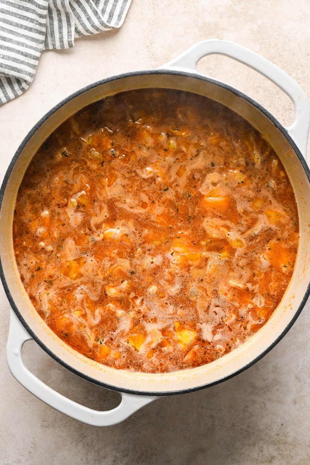 How to make Brothy Sausage and Potato Soup with Kale and Cabbage: Soup simmering.