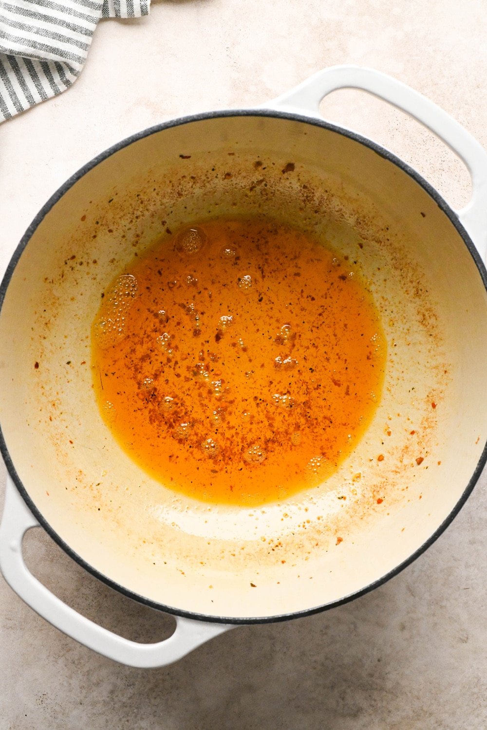 How to make Brothy Sausage and Potato Soup with Kale and Cabbage: Oil left behind in the pot after cooking the sausage.