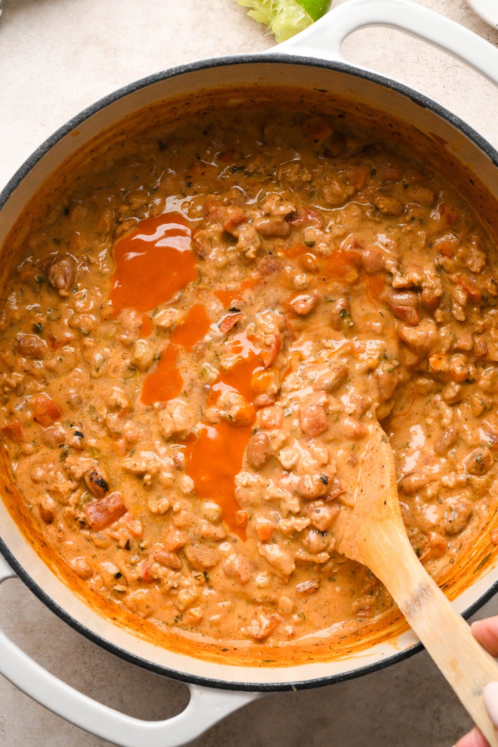 How to make Cashew Cream Buffalo Chicken Chili Made with Ground Chicken: Soup drizzled with more buffalo sauce to taste.