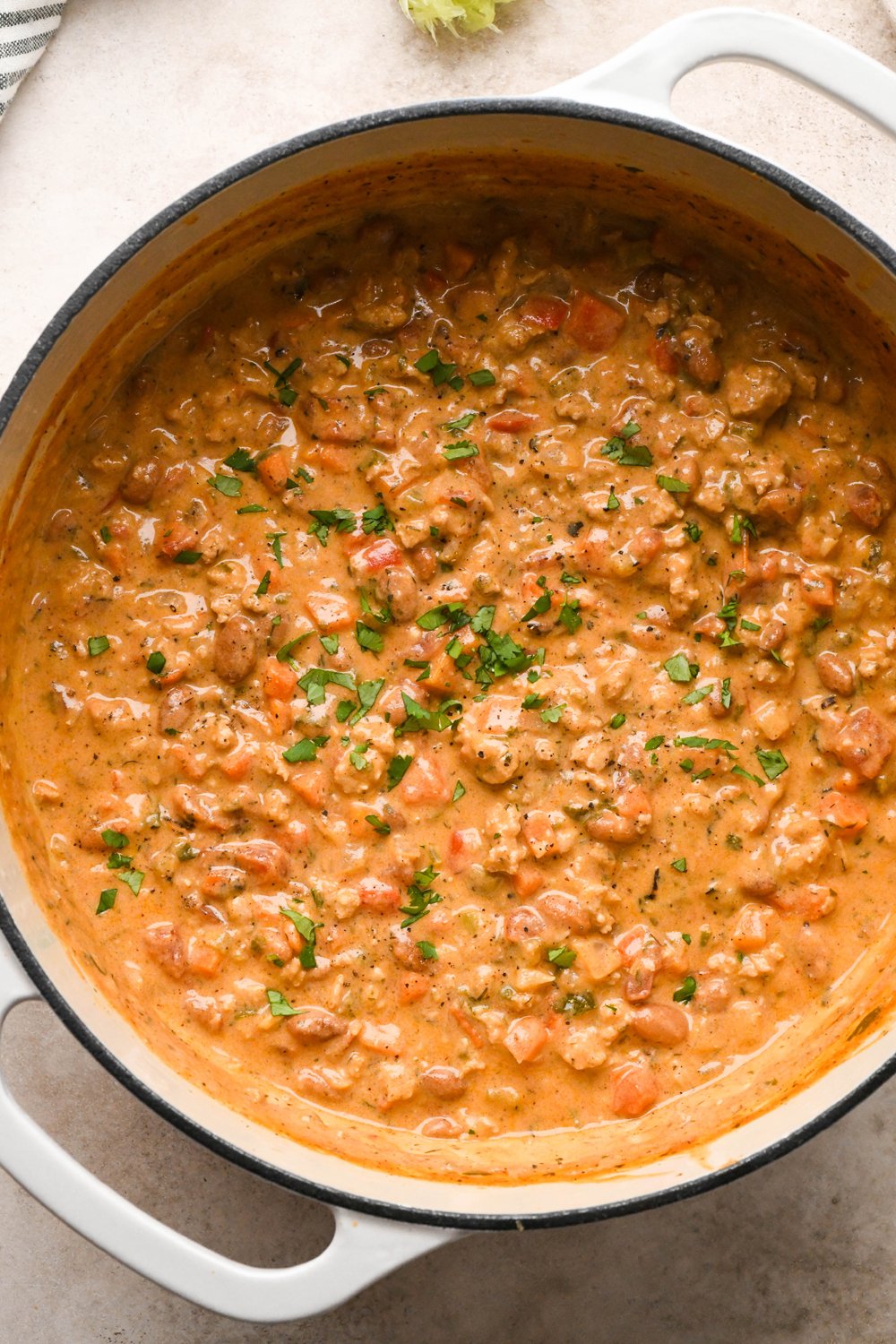 How to make Cashew Cream Buffalo Chicken Chili Made with Ground Chicken: Pot of soup topped with chopped fresh cilantro.