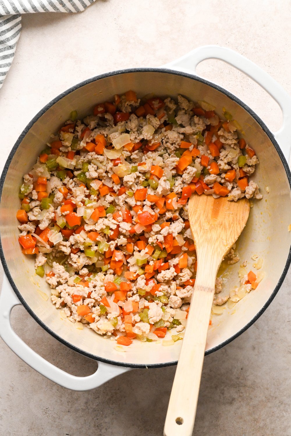 How to make Cashew Cream Buffalo Chicken Chili Made with Ground Chicken: Ground chicken in the soup pot with diced veggies after breaking up with a spatula until fully cooked.