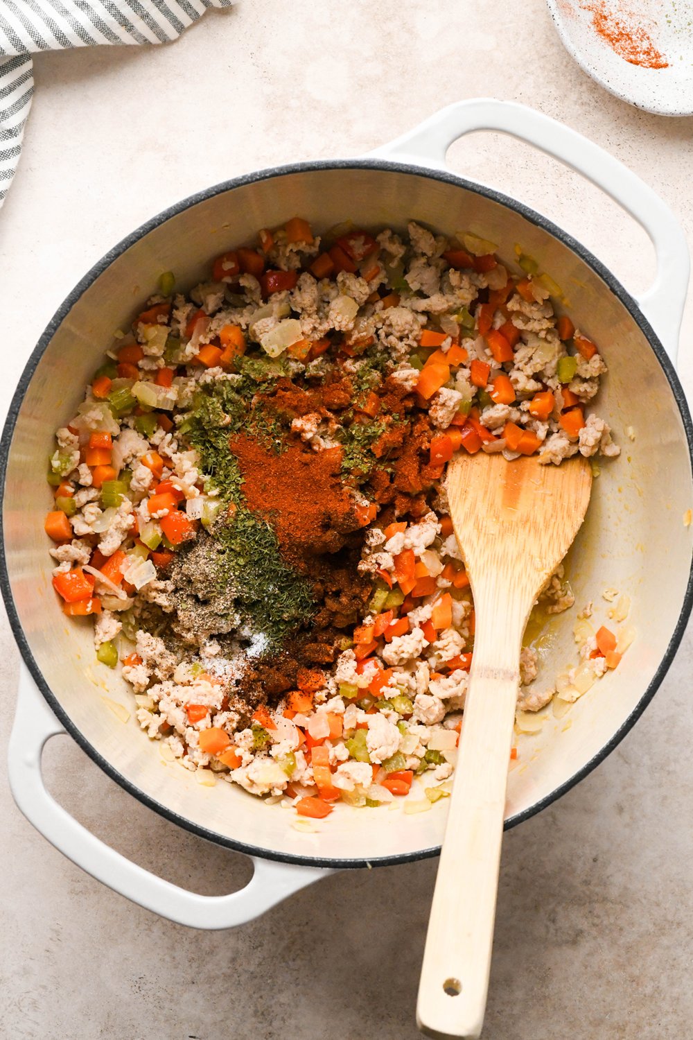 How to make Cashew Cream Buffalo Chicken Chili Made with Ground Chicken: Dried spices added to the pot with the chicken and vegetables.