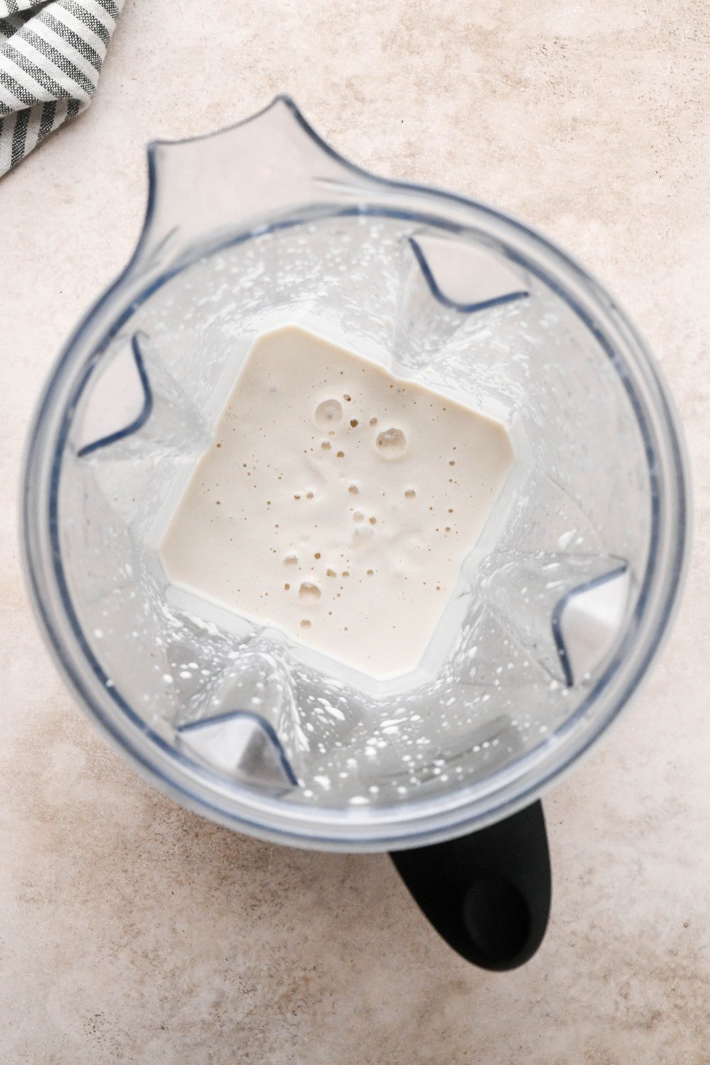 How to make Chicken and Broccoli Soup: Raw, soaked cashews in a blender container with some chicken broth - after blending into a silky smooth cashew cream mixture.
