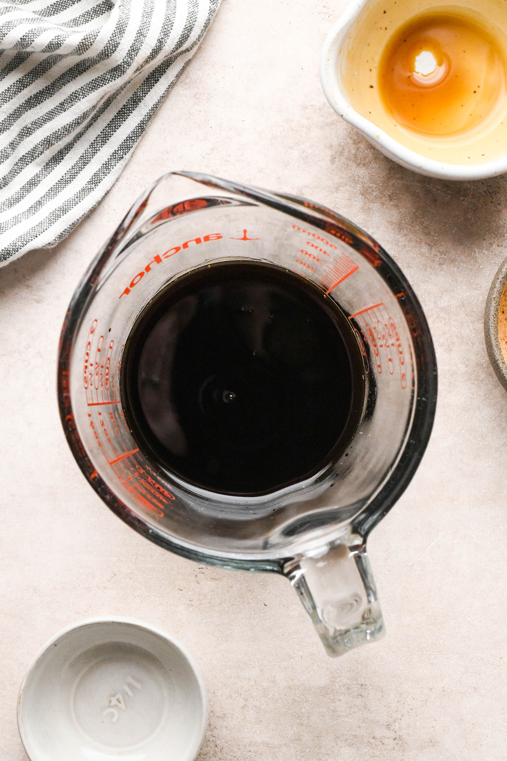 How to make garlic scallion noodles: Coconut aminos, tamari, and rice vinegar combined in a 2 cup pyrex liquid measure cup.